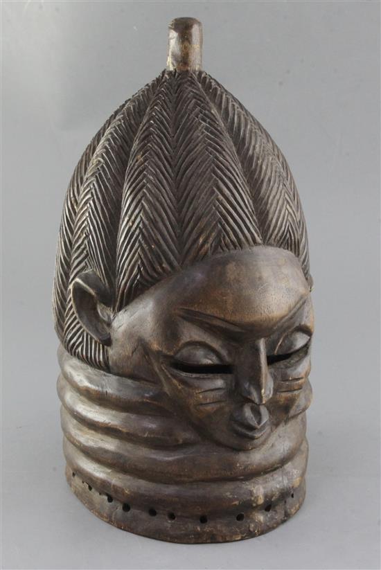 A Mende helmet mask, with braided coiffeur, height 37cm
